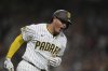 San Diego Padres' Manny Machado celebrates after hitting a three-run home run during the seventh inning of a baseball game against the New York Mets Tuesday, July 29, 2025, in San Diego. (AP Photo/Gregory Bull)