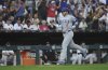 Chicago Cubs left fielder Ian Happ (8) celebrates a solo home run during the seventh inning of a baseball game between the Chicago Cubs and Chicago White Sox, Saturday, July 26, 2025, in Chicago. (AP Photo/Talia Sprague)