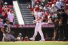 Los Angeles Angels' Mike Trout, center, gestures after hitting a home run during the fifth inning of a baseball game against the Seattle Mariners, Sunday, July 27, 2025, in Anaheim, Calif. (AP Photo/William Liang)