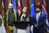 Yara Shoufani of Palestinian Youth Movement speaks alongside Alex Paterson with Canadians for Justice and Peace in the Middle East, left, and Corey Balsam of Independent Jewish Voices during a press conference on Parliament Hill in Ottawa on Tuesday, July 29, 2025. THE CANADIAN PRESS/Sean Kilpatrick