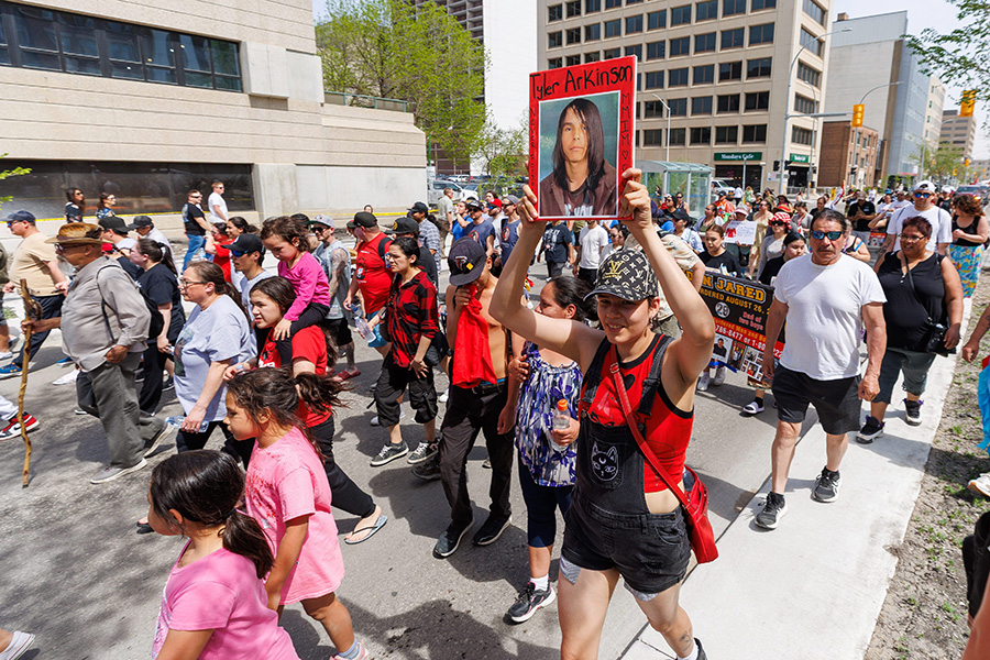 Southern Chiefs’ Organization (SCO) leads a march along Broadway, Tuesday afternoon, from the CMHR to the Manitoba Legislative Building to honour the lives and raising awareness for missing and murdered Indigenous men and boys (MMIMB).