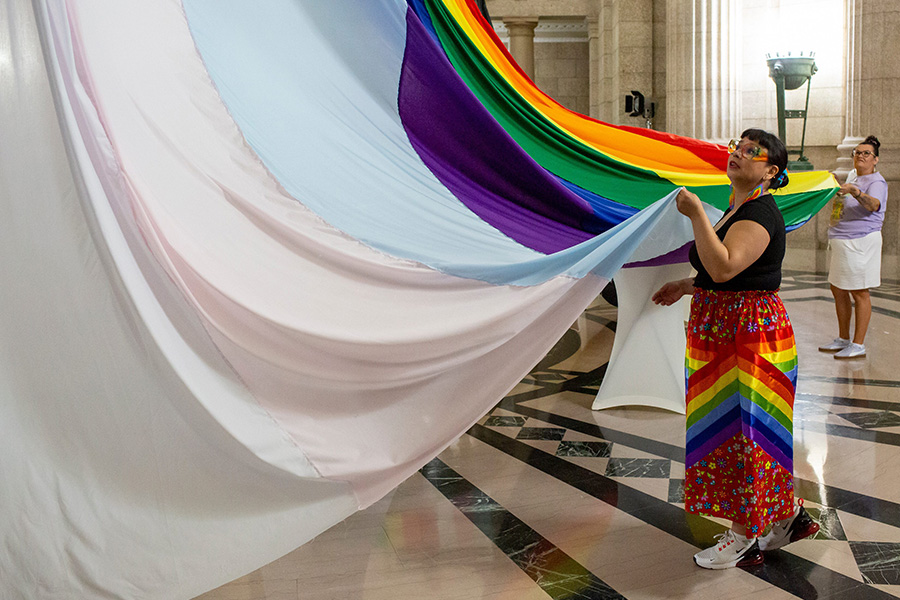 The province hosts a Pride Month celebration in the rotunda at the Manitoba Legislative Building in Winnipeg, Man., Thursday, May 29, 2025. Pictured: Special Advisor on Indigenous Women's Issues in Manitoba Cora Morgan (left) and Amber Laplante help to raise a pride flag banner in the Rotunda.