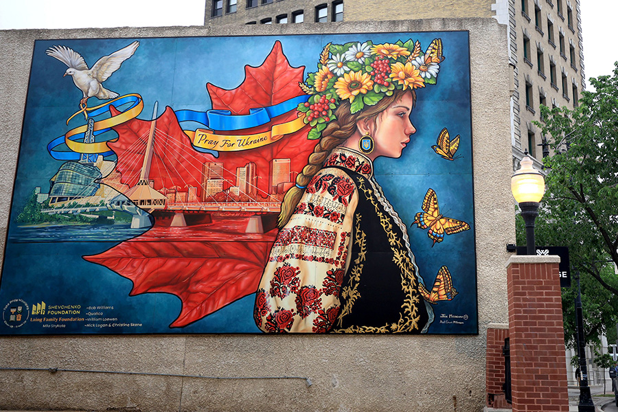 Take Pride Winnipeg unveiled a new mural at 492 Main Street Monday. The mural titled “Pray for Ukraine” would not have been completed without tireless effort of Ukrainian activist Liudmyla Shykota.