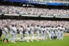 Milwaukee Brewers players walk onto the field for the ceremonial first pitch during the Bob Uecker Celebration of Life before a baseball game against the San Francisco Giants, Sunday, Aug. 24, 2025, in Milwaukee. (AP Photo/Jeffrey Phelps)