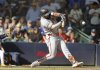 San Francisco Giants' Heliot Ramos hits a two-run single during the ninth inning of a baseball game against the Milwaukee Brewers, Sunday, Aug. 24, 2025, in Milwaukee. (AP Photo/Jeffrey Phelps)