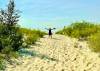 photos by Gord Mackintosh
                                Margie Mackintosh rejoices at Grand Beach&rsquo;s quieter East Beach at Lake Winnipeg.