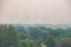 MIKE DEAL / FREE PRESS
                                A smoke-laden Winnipeg skyline as seen from Garbage Hill (Westview Park) early Monday morning. Standup 250602 - Monday, June 02, 2025.