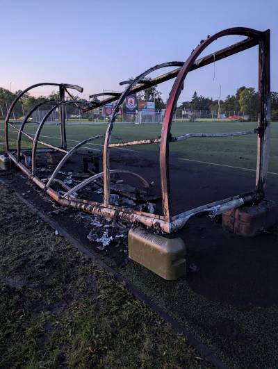 Supplied
                                The remains of one of the covered players bench that was burnt in a fire started be a group of youths at the Bonivital Soccer Club.