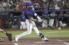 Arizona Diamondbacks' Blaze Alexander hits a three-run double against the Colorado Rockies in the first inning of a baseball game Friday, Aug. 8, 2025, in Phoenix. (AP Photo/Rick Scuteri)