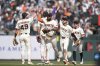 San Francisco Giants ' Tyler Fitzgerald, left, celebrates with Willy Adames, middle rear, Heliot Ramos, middle, Jung Hoo Lee, second from right, and Drew Gilbert after a baseball game against the Tampa Bay Rays in San Francisco, Sunday, Aug. 17, 2025. (AP Photo/Jeff Chiu)