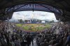The 20 Little League teams participating in the Little League World Series line the infield as the Seattle Mariners, line the third baseline, and the New York Mets line the first baseline before the Little League Classic baseball game at Bowman Field in Williamsport, Pa., Sunday, Aug. 17, 2025. (AP Photo/Gene J. Puskar)