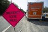 Access to Holyrood, N.L., remains blocked at Seal Cove due to the ongoing wildfire in the region, on Thursday, Aug. 7, 2025. THE CANADIAN PRESS/Paul Daly