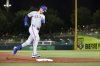 Texas Rangers' Jonah Heim rounds the bases after hitting a solo home run during the fifth inning of a baseball game against the Athletics, Friday, Aug. 29, 2025, in West Sacramento, Calif. (AP Photo/Sara Nevis)