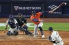 Houston Astros' Carlos Correa (1) hits an RBI single during the 10th inning of a baseball game against the New York Yankees Friday, Aug. 8, 2025, in New York. (AP Photo/Frank Franklin II)