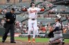 Baltimore Orioles' Gunnar Henderson (2) celebrates his home run in front of Houston Astros catcher Yainer Diaz, right, during the first inning of a baseball game, Sunday, Aug. 24, 2025, in Baltimore. (AP Photo/Nick Wass)