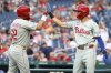Philadelphia Phillies' Kyle Schwarber celebrates with Philadelphia Phillies' Trea Turner after scoring a run during the first inning of a baseball game against the Washington Nationals, Friday, Aug. 15, 2025, in Washington. (AP Photo/Daniel Kucin Jr.)