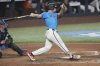 Miami Marlins' Jakob Marsee hits a triple to centre field during the third inning of a baseball game against the Toronto Blue Jays, Sunday, Aug. 24, 2025, in Miami. (AP Photo/Marta Lavandier)