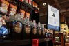 A sign advising that products from the U.S. affected by a tariff will be marked with a symbol at the shelf, along with a QR code linking to a Government of Canada website, is seen beside a display of Canadian products in a grocery store in Ottawa, on Wednesday, April 2, 2025. THE CANADIAN PRESS/Justin Tang