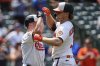 Baltimore Orioles' Gunnar Henderson, right, celebrates with Tyler O'Neill, left, after hitting a three-run home run during the seventh inning in the first baseball game of a doubleheader against the Toronto Blue Jays, Tuesday, July 29, 2025, in Baltimore. (AP Photo/Stephanie Scarbrough)