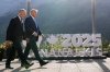 Canada's Prime Minister Mark Carney walks with President Donald Trump after a group photo at the G7 Summit, Monday, June 16, 2025, in Kananaskis, Canada. THE CANADIAN PRESS/AP-Mark Schiefelbein