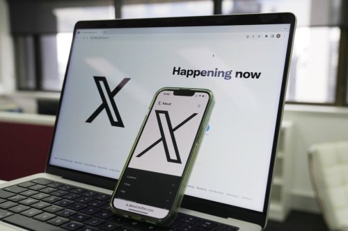FILE - The opening page of X is displayed on a computer and phone in Sydney on Oct. 16, 2023. (AP Photo/Rick Rycroft, File)