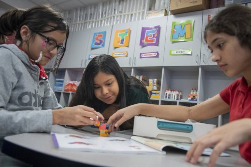 Students build a dragon out of LEGO bricks during class at Lively Elementary on Thursday, Aug. 21, 2025, in Irving, Texas. (AP Photo/Ronaldo Bolaños)