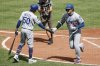 Los Angeles Dodgers' Shohei Ohtani (17) is greeted by Mookie Betts (50) after hitting a home run against Baltimore Orioles pitcher Tomoyuki Sugano during the third inning of a baseball game, Sunday, Sept. 7, 2025, in Baltimore. (AP Photo/Terrance Williams)