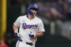 Texas Rangers' Corey Seager rounds the bases after hitting a solo home run in the seventh inning of a baseball game against the Los Angeles Angels, Tuesday, Aug. 26, 2025, in Arlington, Texas. (AP Photo/Tony Gutierrez)