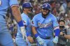 Texas Rangers' Jake Burger, front right, and Josh Jung celebrate after scoring on a Burger home run during the sixth inning of a baseball game against the Houston Astros, Sunday, Sept. 7, 2025, in Arlington, Texas. (AP Photo/LM Otero)