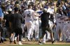 Los Angeles Dodgers' Will Smith (16) celebrates after his walkoff solo home run with teammates during the ninth inning of a baseball game against the Arizona Diamondbacks in Los Angeles, Sunday, Aug. 31, 2025. (AP Photo/Kyusung Gong)