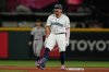 Seattle Mariners' Josh Naylor reacts after hitting a three-run double that scored Luke Raley, J.P. Crawford, and Julio Rodriguez during the eighth inning of a baseball game against the Colorado Rockies, Tuesday, Sept. 23, 2025, in Seattle. (AP Photo/Ryan Sun)