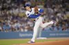 Los Angeles Dodgers starting pitcher Shohei Ohtani works against a Philadelphia Phillies batter during the first inning of a baseball game Tuesday, Sept. 16, 2025, in Los Angeles. (AP Photo/Mark J. Terrill)