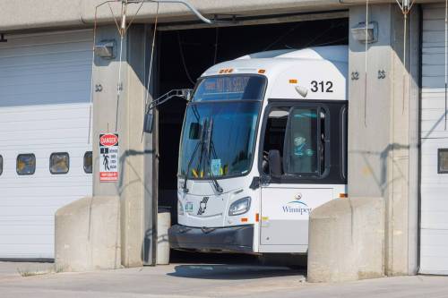 MIKE DEAL / FREE PRESS
                                Winnipeg Transit bus leaves the Osborne Street Garage.