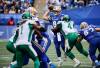 Winnipeg Blue Bombers quarterback Zach Collaros (8) gets the pass off despite pressure from Saskatchewan Roughriders&rsquo; Micah Johnson (4) during first half CFL action in Winnipeg, Saturday, Sept. 6, 2025. THE CANADIAN PRESS/John Woods