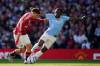 Dave Thompson / THE ASSOCIATED PRESS FILES
                                Manchester United&rsquo;s Manuel Ugarte (left) and Manchester City&rsquo;s Jeremy Doku fight for the ball the last time the two teams met back in April. Sunday&rsquo;s Derby will be the least competitive in a generation as both Premier clubs are suffering dismal seasons.