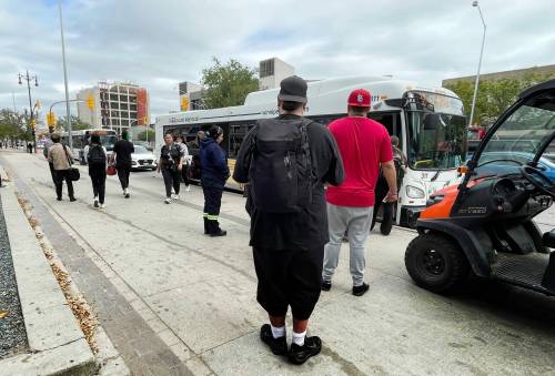 RUTH BONNEVILLE / FREE PRESS
                                Transit users prepare to board a bus Wednesday.