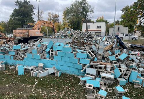 Ruth Bonneville / Free Press
                                Crews work on demolishing Happyland outdoor pool on Marion Street, Thursday. In an attempt to convince city council to keep the pool open for another season, area residents raised $86,000 last year to go toward the pool&rsquo;s operating costs. Instead, council cast a final vote to close the facility.