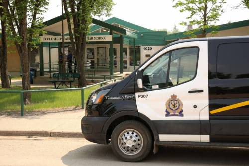 A Brandon police vehicle sits parked in front of École secondaire Neelin High School on June 10 after a violent attack inside the school. (Tim Smith / The Brandon Sun files)
