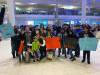 Staff at Naomi House and members of City Church greet the arrival of a refugee family from Afghanistan at the Winnipeg airport. (Supplied)