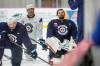 MIKE DEAL / FREE PRESS FILES
                                Winnipeg Jets&rsquo; Ethan Frisch (73), Dylan Samberg (54), and goalie Connor Hellebuyck (37) hit the ice during training camp on Sept. 18. Hellebuyck missed Monday&rsquo;s practice and Samberg is out with a broken wrist.