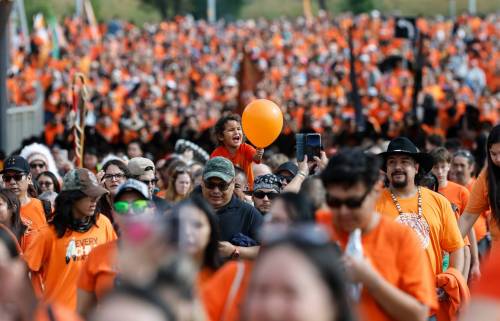 JOHN WOODS / FREE PRESS
                                Thousands clad in orange marched from Oodena Circle at The Forks to the RBC Convention Centre to mark Truth and Reconcilliation Day.