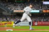 New York Yankees' Aaron Judge rounds third base after hitting a three-run home run against the Toronto Blue Jays during the third inning of Game 3 of baseball's American League Division Series, Tuesday, Oct. 7, 2025, in New York. (AP Photo/Yuki Iwamura)