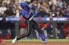 Seattle Mariners' Mitch Garver hits a home run against the Los Angeles Angels during seventh inning of a baseball game Friday, Sept. 12, 2025, in Seattle. (AP Photo/Kevin Ng)