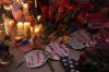 Flags, candles and signs sit at a vigil for Charlie Kirk, the CEO and co-founder of Turning Point USA who was shot and killed, Thursday, Sept. 11, 2025, in Orem, Utah. (AP Photo/Lindsey Wasson)