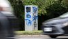 Cars zoom past a vandalized traffic speed camera beside High Park in Toronto on Thursday August 24, 2023. THE CANADIAN PRESS/Frank Gunn