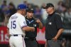 Texas Rangers manager Bruce Bochy (15) argues with home plate umpire Stu Scheurwater, left, and third base umpire John Bacon after being ejected from a baseball game during the eighth inning Saturday, Sept. 20, 2025, in Arlington, Texas. (AP Photo/Julio Cortez)