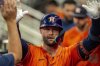 Houston Astros' Christian Walker (8) celebrates after scoring a run during the third inning of a baseball game against the Atlanta Braves, Saturday, Sept. 13, 2025, in Atlanta. (AP Photo/Erik Rank)
