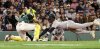 New York Yankees' Jazz Chisholm, Jr., right, dives towards home plate getting tagged out by Boston Red Sox catcher Carlos Narváez during the eighth inning of a baseball game, Friday, Sept. 12, 2025, in Boston. (AP Photo/Mark Stockwell)