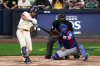 Milwaukee Brewers' Blake Perkins hits a double during the seventh inning of Game 1 of baseball's National League Division Series against the Chicago Cubs Saturday, Oct. 4, 2025, in Milwaukee. (AP Photo/Morry Gash)