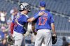 Chicago Cubs pitcher Taylor Rogers, right, celebrates with catcher Reese McGuire, left, after getting the final out of a baseball game against the Pittsburgh Pirates Wednesday, Sept. 17, 2025, in Pittsburgh. (AP Photo/Matt Freed)